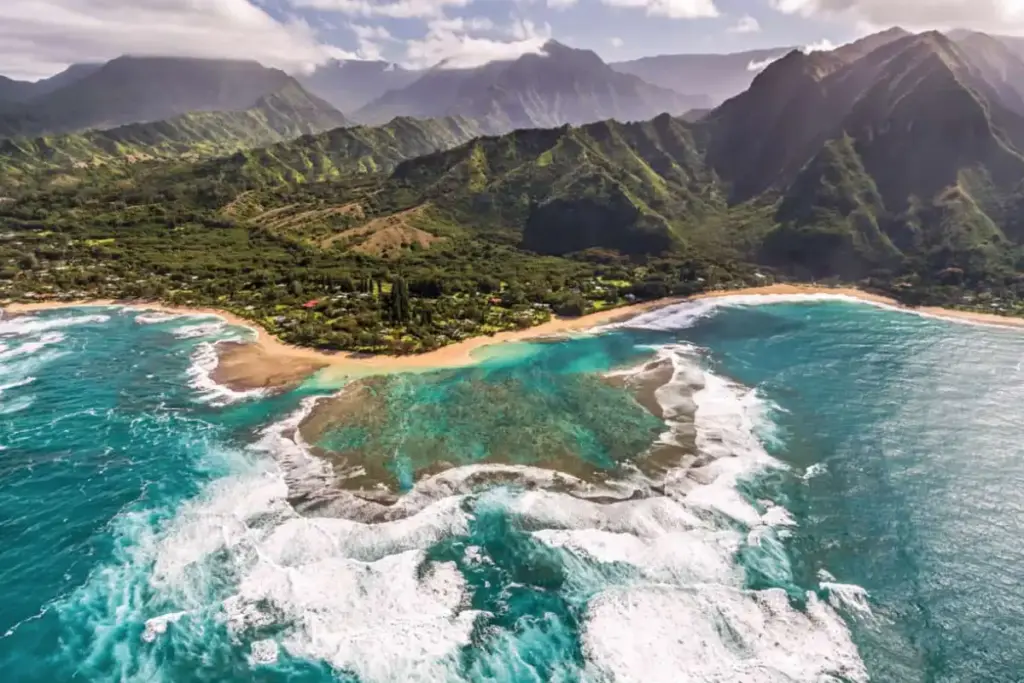 Kauai Trip Planning Tips: Must-See Trails & Beaches snorkelers exploring the coral reefs at tunnels beach