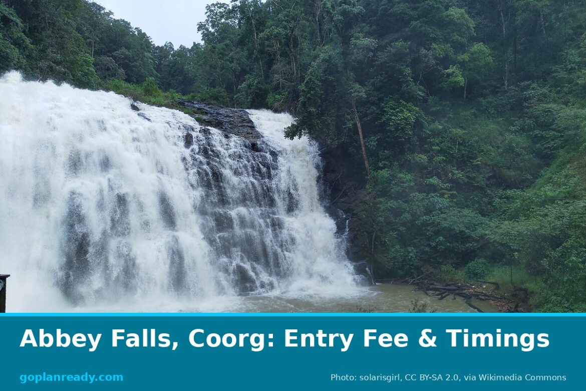 Abbey Falls near Madikeri in full monsoon flow, white water over dark rock with dense green forest, with the title Abbey Falls, Coorg: Entry Fee & Timings