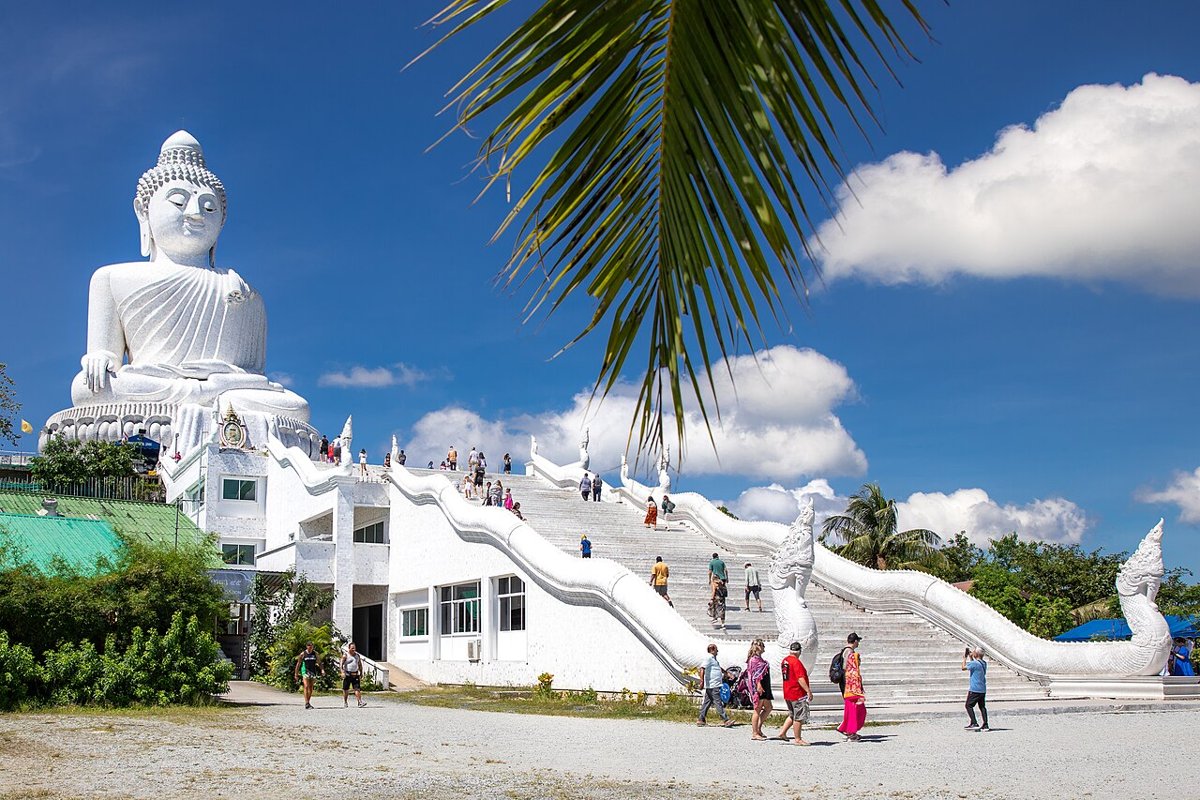 Visitors on the white staircase leading up to the 45-metre white marble Big Buddha statue on Nakkerd Hill, Phuket