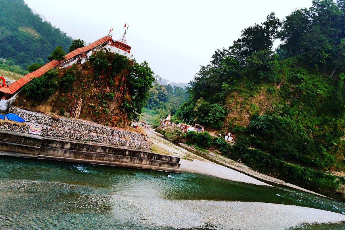 Nainital to Jim Corbett Distance: Kaladhungi Route vs Haldwani Route, Drive Time and Safari Gates Garjiya Devi temple with its orange roof on a rocky hill above the Kosi River near Ramnagar, with forested slopes behind