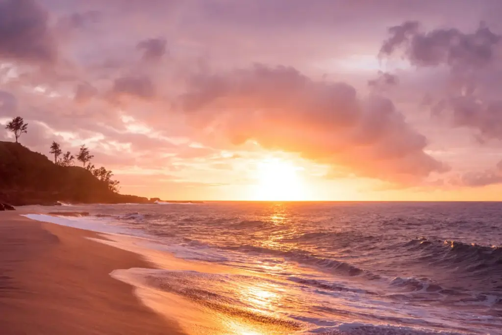 Kauai Trip Planning Tips: Must-See Trails & Beaches kauai trip planning tips with beautiful sunset beach and ocean waves