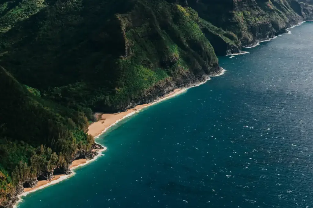 Kauai Trip Planning Tips: Must-See Trails & Beaches Kauai trip planning tips with dramatic Na Pali Coast cliffs and ocean view