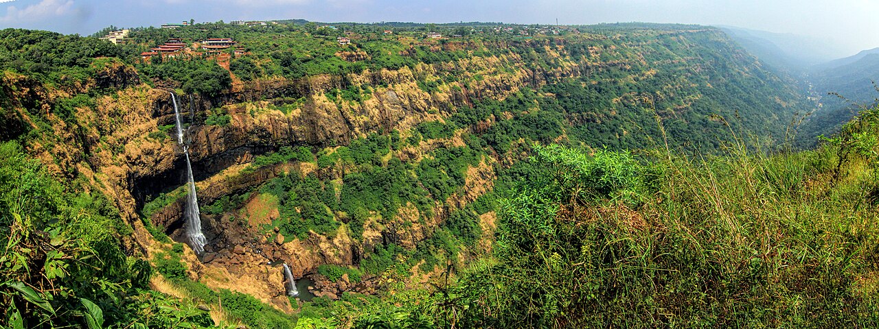 Lingmala Waterfall, Mahabaleshwar: Entry Fee, Timings and Best Time Panoramic view of Lingmala Falls dropping into the forested Venna valley gorge, with a second smaller fall lower down and buildings on the plateau rim