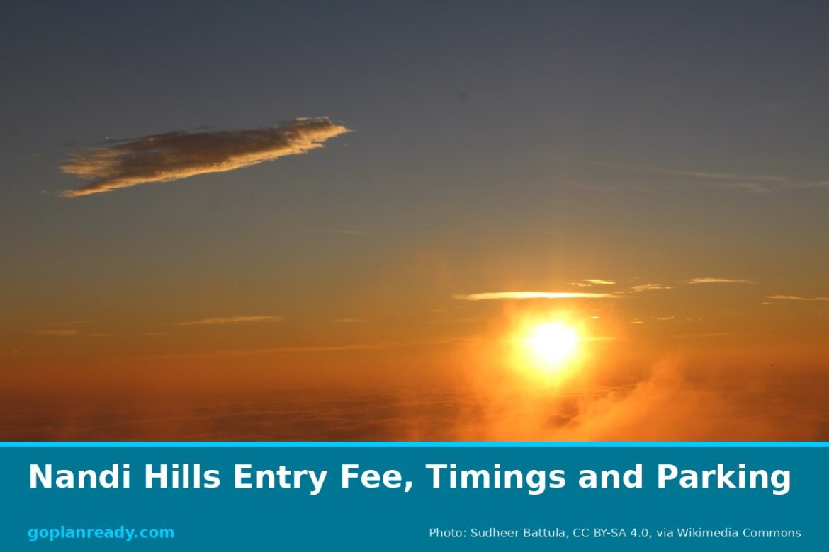 Orange sun rising above a layer of cloud and haze at dawn, seen from Nandi Hills, with the title Nandi Hills Entry Fee, Timings and Parking