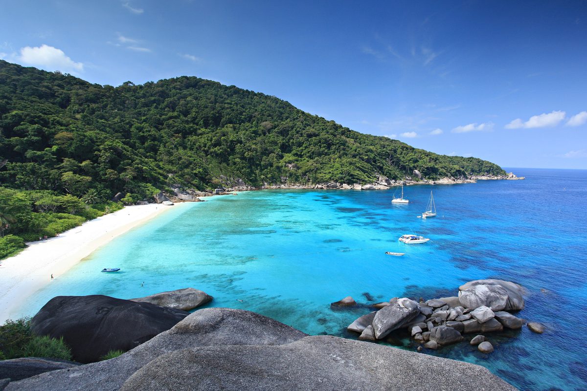 Turquoise bay and white sand beach below forested hills on Ko Similan, Mu Ko Similan National Park, Phang Nga
