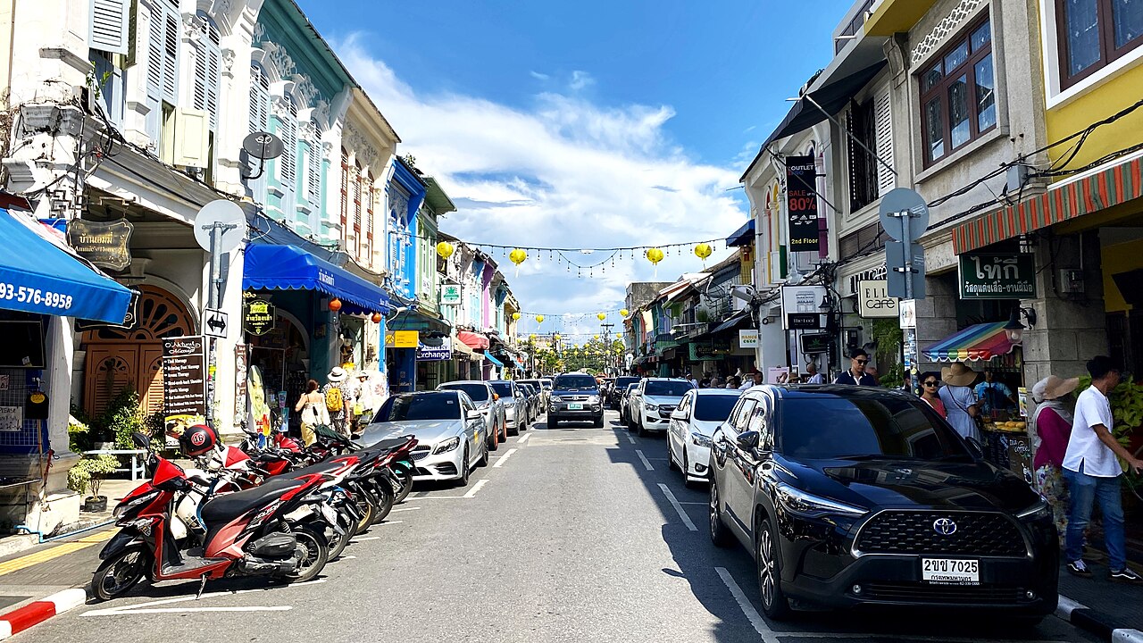 Thalang Road in Phuket Old Town in daytime, with Sino-Portuguese shophouses and hanging lanterns