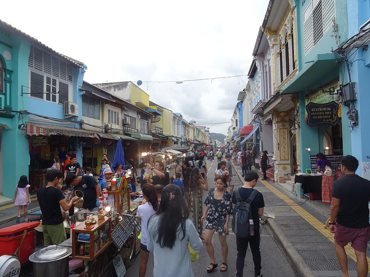 Food carts and shoppers on Thalang Road during the Sunday walking street in Phuket Old Town